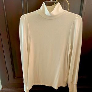 Soft white loose fitting turtleneck